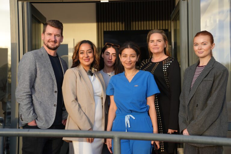 A New Era in Regenerative Aesthetics | Dr Keiron Lord and the Revive NX UK team standing together outside the new waterfront clinic in Leigh, Greater Manchester, during the national Regenerative Aesthetics Roadshow.