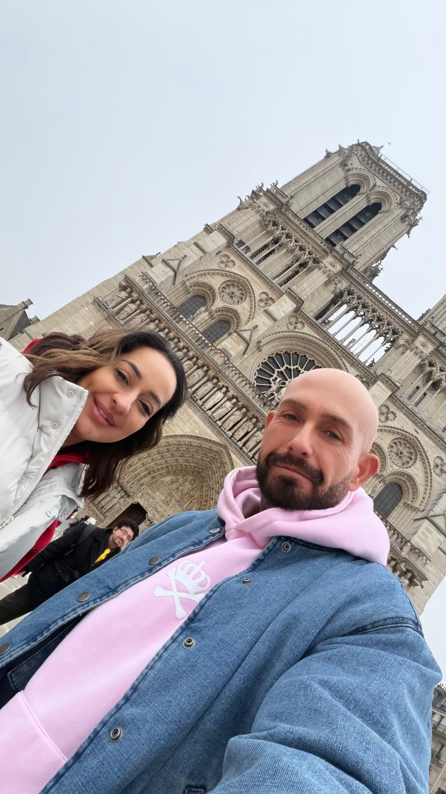 Nita McEvoy and Steven Lewis Barrett outside Notre Dame Cathedral in Paris during IMCAS Paris 2026